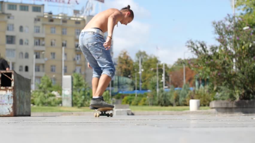 Sexy Flexible Girl Doing Splits On Roller Skates In Exotic Outdoors On
