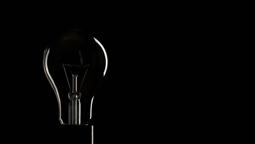 Real Light Bulb Turning On And Turning Off On Black Background, Copy 