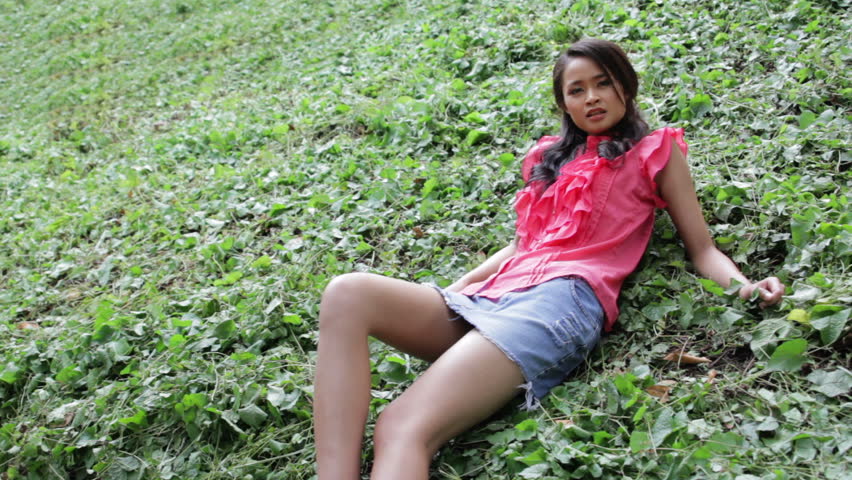 video clip stock fooe sexy erotic asian girl with mini skirt grass video clip stock fooe sexy erotic asian girl with mini skirt grass