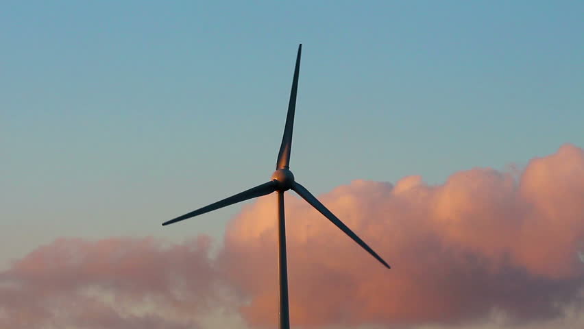 Field Of Single Blade Wind Turbines In Function On A Windy Day Stock