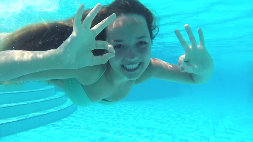 Woman Swimming Underwater In Slow Motion Stock Footage Woman Swimming Underwater In Slow Motion Stock Footage