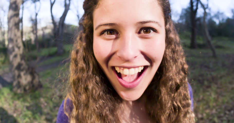 Cute Young Woman, Face Distorted By Fish-eye Lens, Smiles Looking Goofy ...