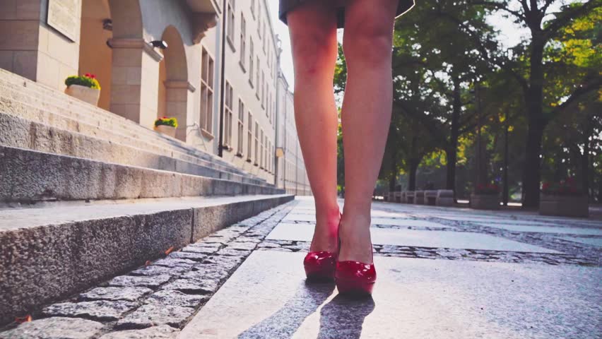Sexy Woman Legs In Red High Heels Shoes Walking In The City Urban ...