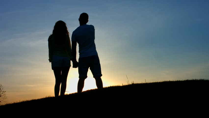 Couple Walks Into Sun Up Hill And Then Stops To Take In Romantic ...