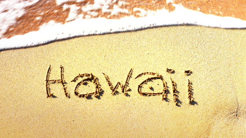 The Word Hawaii Is Written In The Sand On This Beach In Oahu While A ...