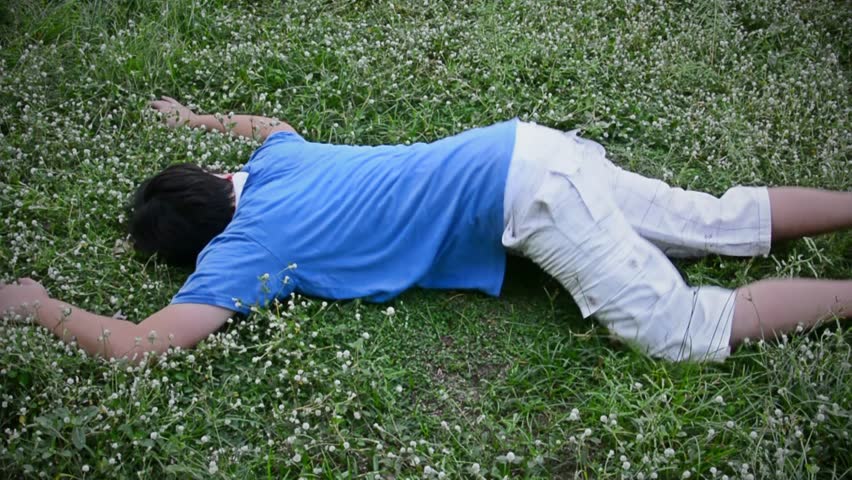 An Asian Thai Male Man Guy Is Drop Dead On The Grassy Ground Field From ...