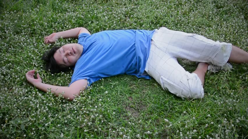 An Asian Thai Man Guy Drop Dead On The Grassy Ground Field In HD Stock ...