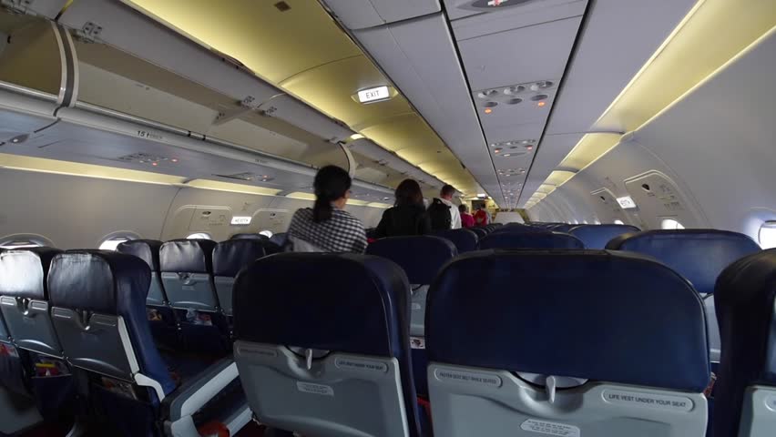 Inside Airplane. Passengers Sitting In Aircraft. Airborne. Flying ...