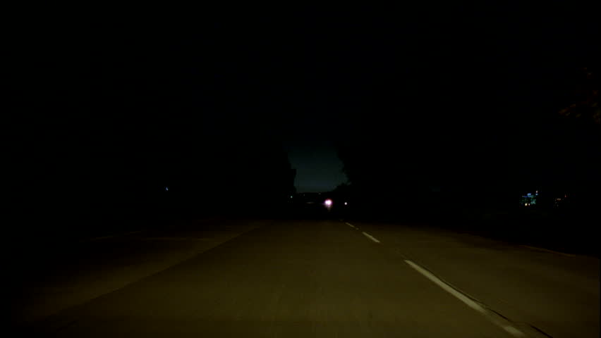 Driving Down Rural Highway In Pitch Black Night Timelapse Loop. Running ...