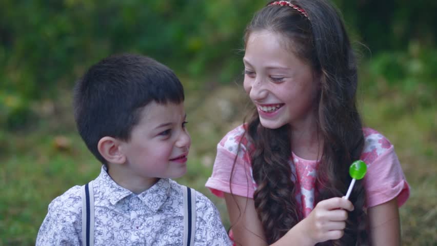 Portrait Of Little Boy Kissing Pretty Girl. Cute Couple In Love. Happy ...