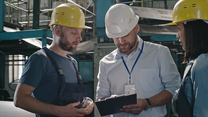 pan of male bearded factory hr asking workers questions and making notes at workshop 4k - Duties Of A Forklift Operator pan of male bearded factory hr asking workers questions and making notes at workshop 4k - Duties Of A Forklift Operator