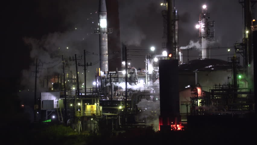 Oil Refinery At Night With Flame. A Working Oil Refinery At Night ...