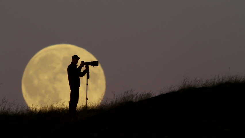 Man Looking Depressed, Sihouetted Against A Rising Full Moon. Stock ...