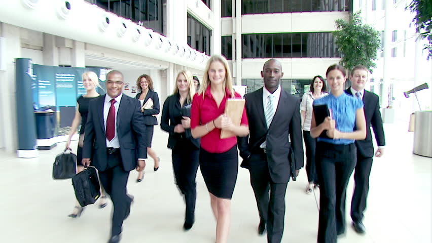 Large Crowd Of Multi Ethnic Business People Stride Across A Large ...