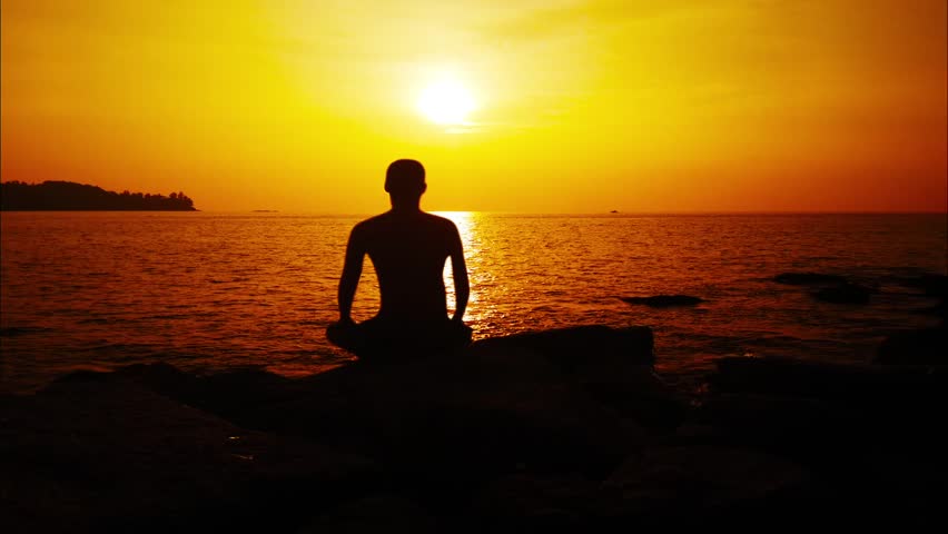 Meditation Near The Sea & Doing Yoga On A Beach At Sunrise Stock ...