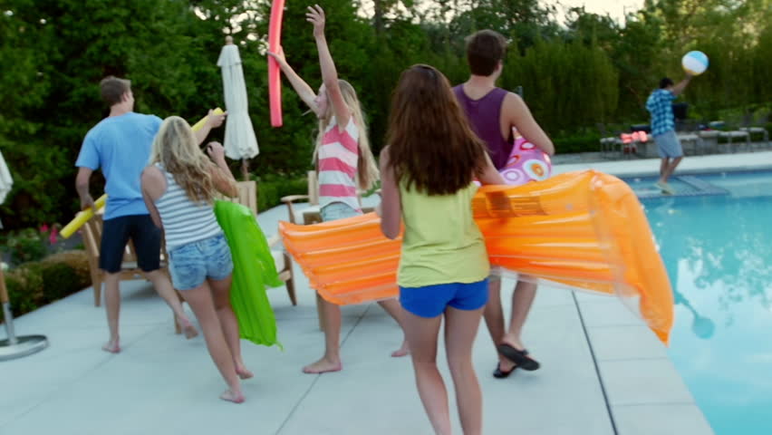 Teen Friends Have A Fun Chicken Fight At A Pool Party, Girls Cheer Them ...