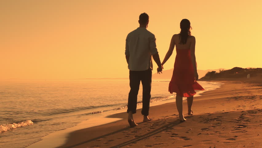 Image result for a couple walking on the beach