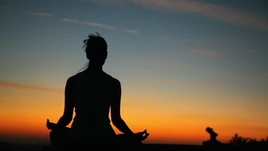 Silhouette Of Woman Meditating During Sunset Stock Footage Video ...